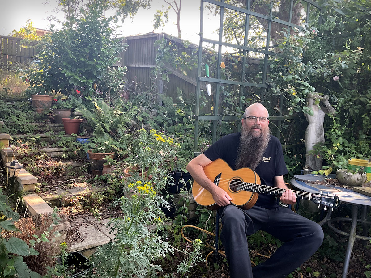 Julian in his garden in his Brook tee shirt